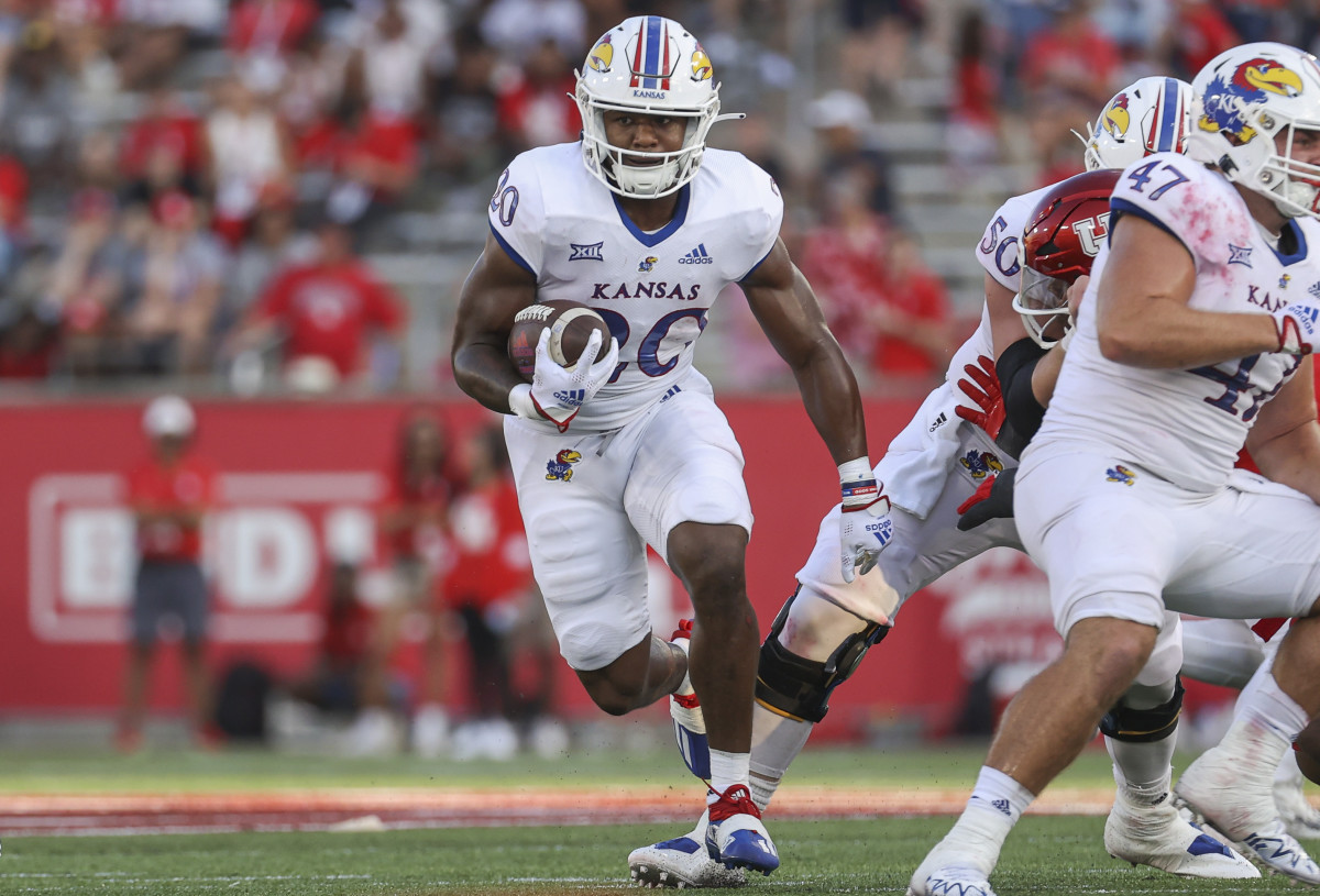 Sep 17, 2022; Houston, Texas, USA; Kansas Jayhawks running back Daniel Hishaw Jr. (20) runs with the ball during the fourth quarter against the Houston Cougars at TDECU Stadium. Mandatory Credit: Troy Taormina-USA TODAY Sports